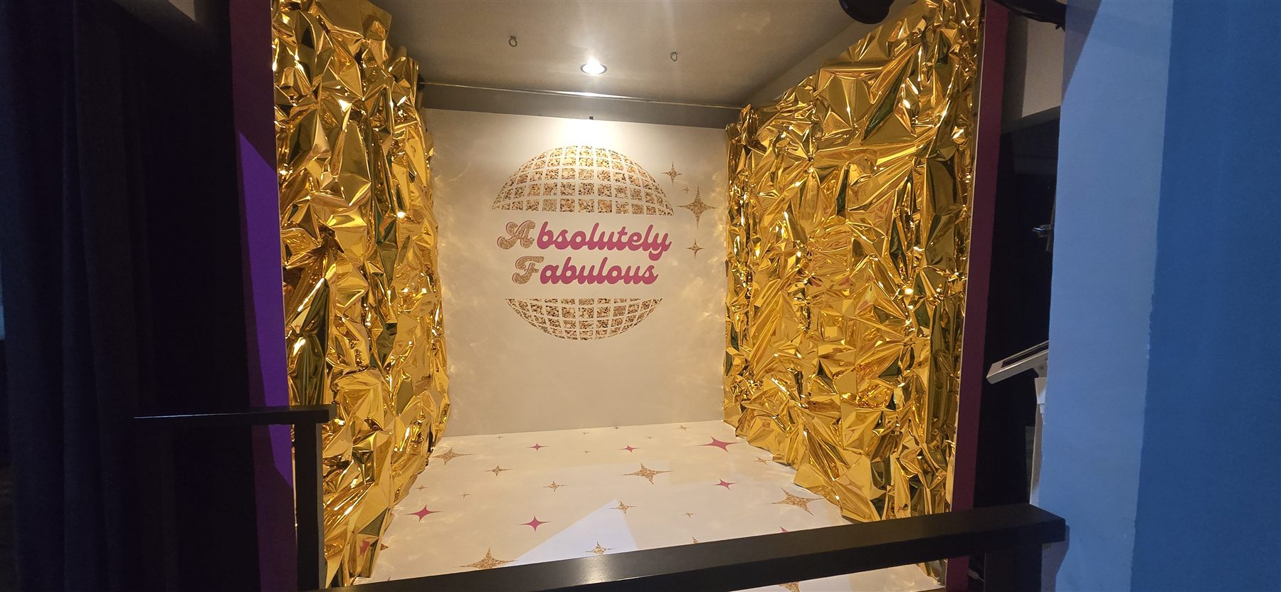 Gold foil photo booth installation by Adicora