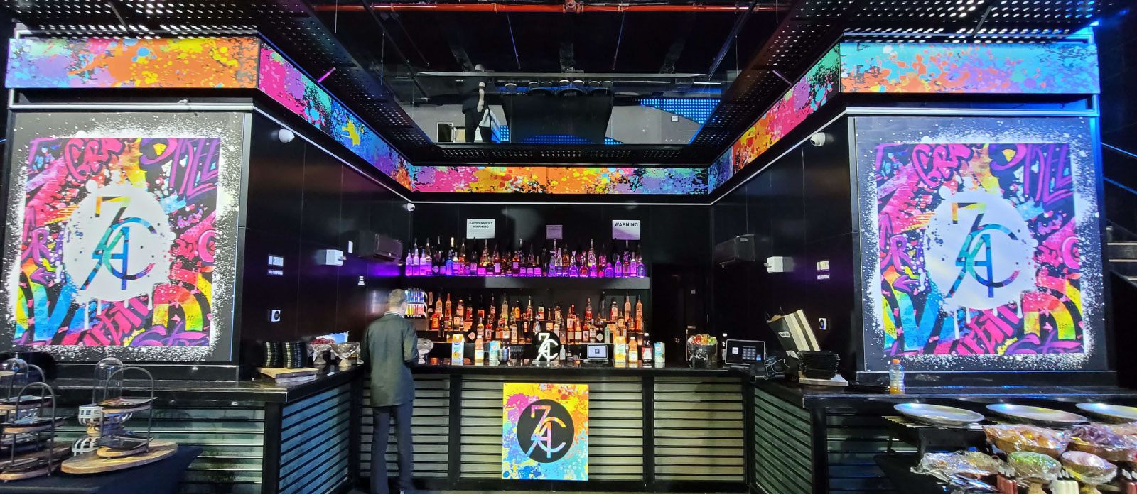 Branded event bar design by Adicora