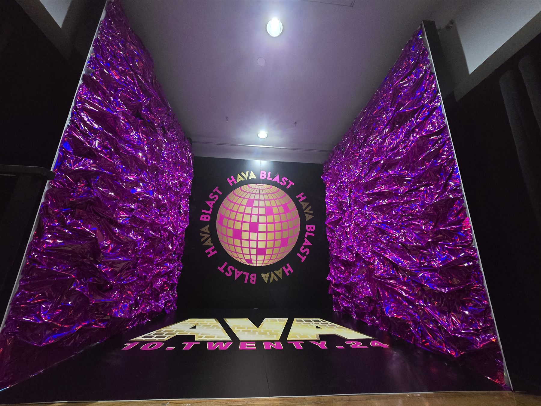 Purple foil entrance installation by Adicora