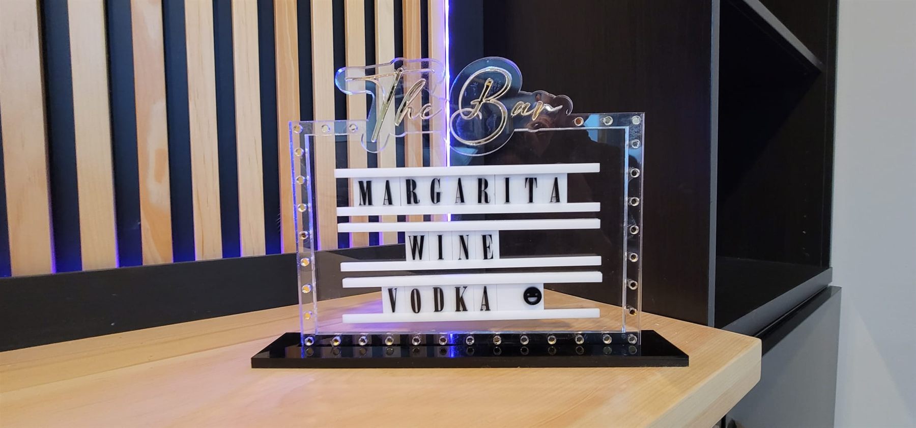 Custom laser-cut acrylic bar sign by Adicora
