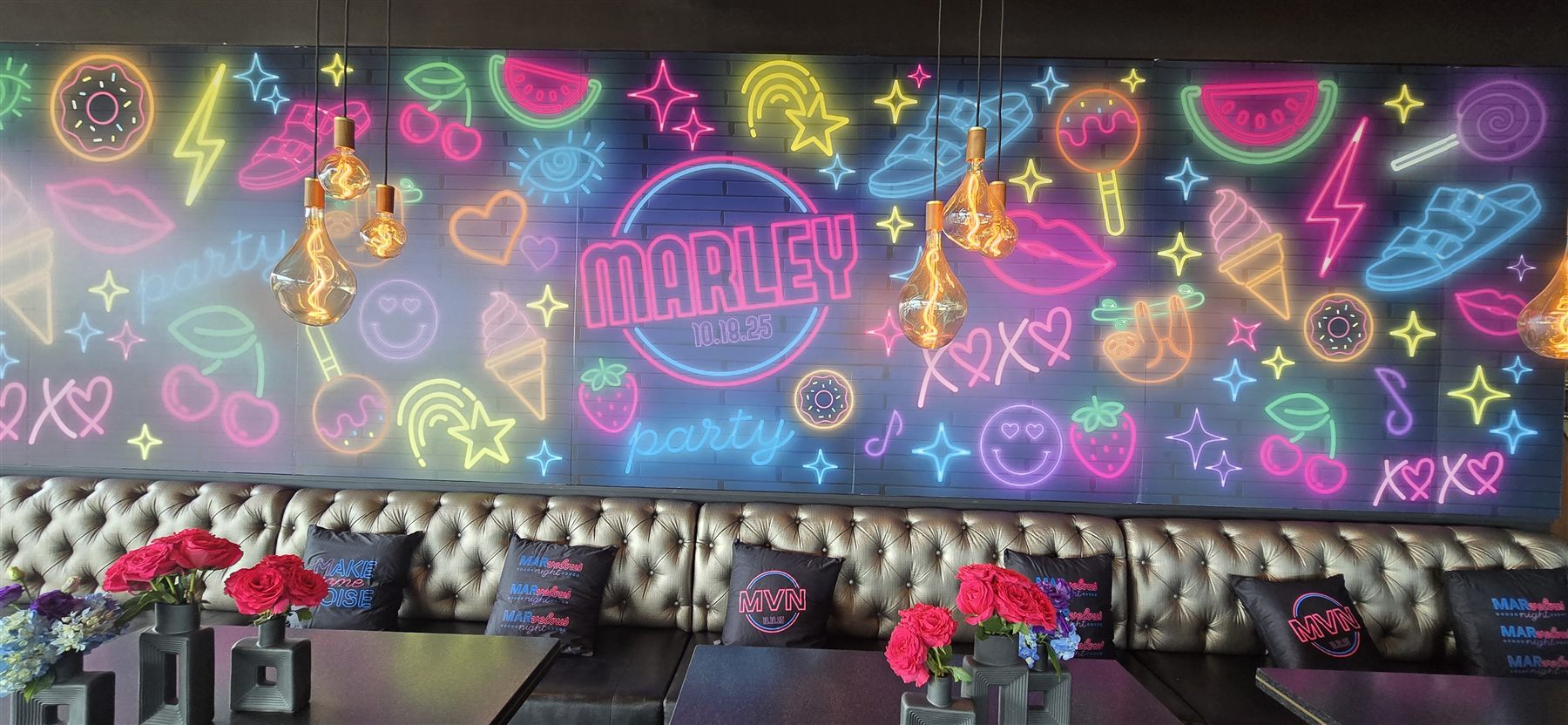 Neon-style printed party mural by Adicora